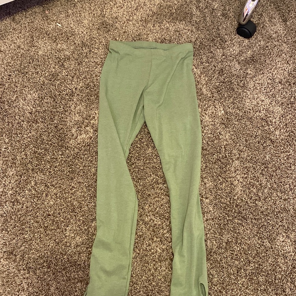 Green leggings , never worn , brand new